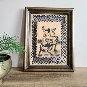 Framed tooled leather painting.